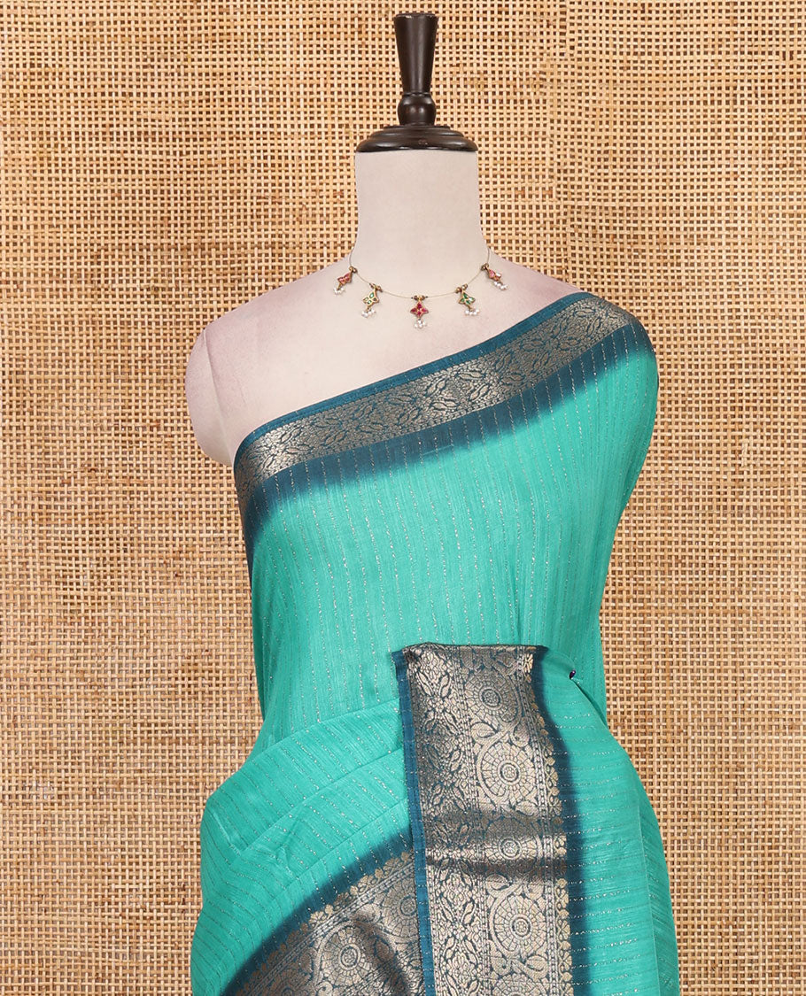 Rama green gold zari vertical striped dola silk saree, contrast traditional zari border of manga design, striped pallu & contrast diamond design blouse