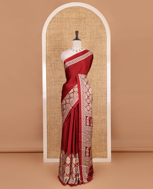 Maroon plain gajji silk saree with ajrak printed border, ajrak printed geometric pallu, and printed blouse