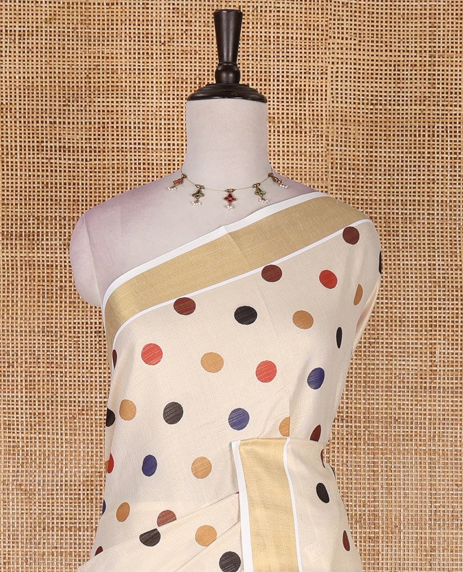 Cream multi-color polka dots printed Kerala tissue cotton saree, zari bavanji border, polka dots printed pallu, and small dots printed blouse