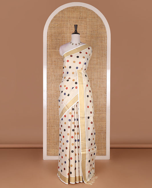 Cream multi-color polka dots printed Kerala tissue cotton saree, zari bavanji border, polka dots printed pallu, and small dots printed blouse