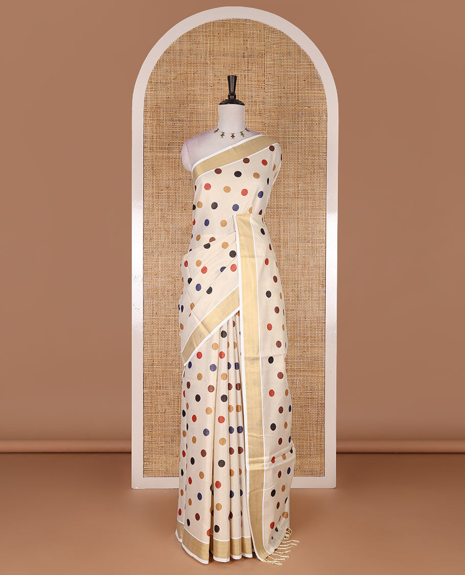 Cream multi-color polka dots printed Kerala tissue cotton saree, zari bavanji border, polka dots printed pallu, and small dots printed blouse