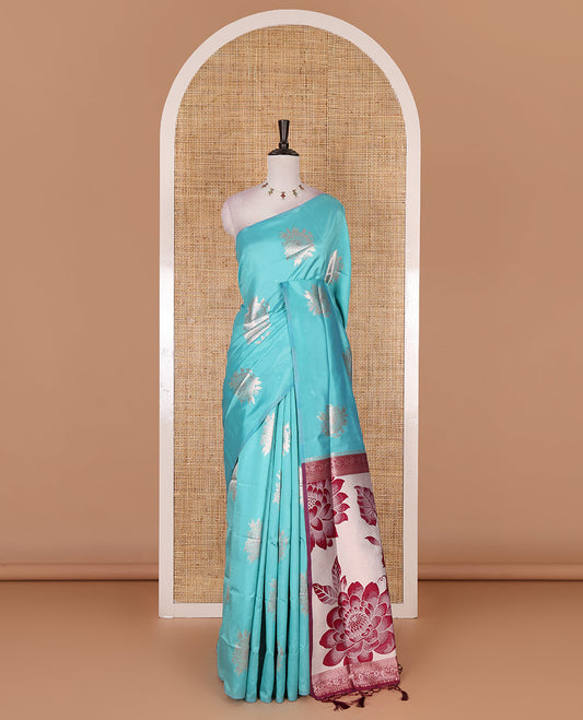 Borderless green floral motifs steeped elite soft silk saree, contrast lotus-like motifs pallu, and contrast buttas blouse