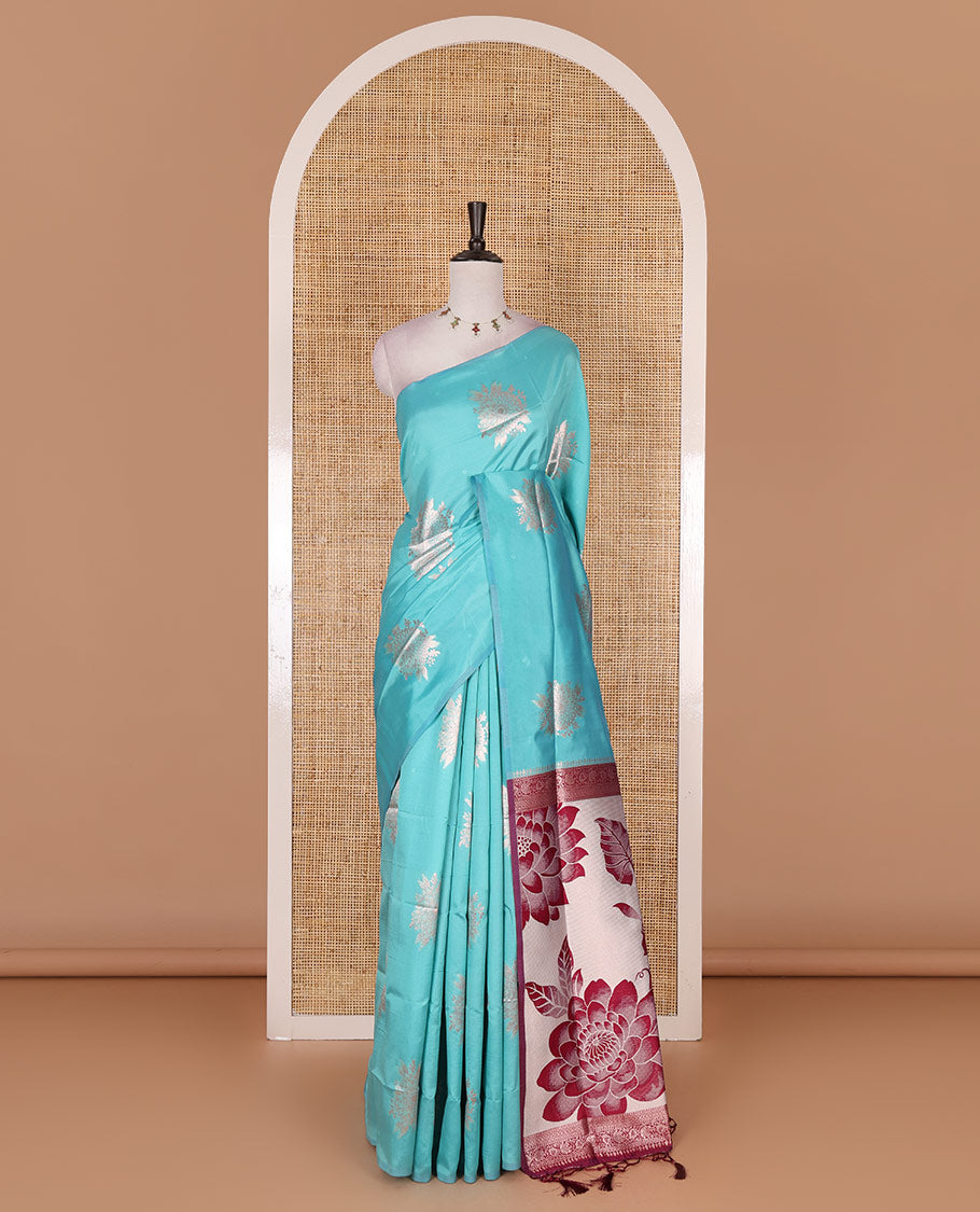Borderless green floral motifs steeped elite soft silk saree, contrast lotus-like motifs pallu, and contrast buttas blouse