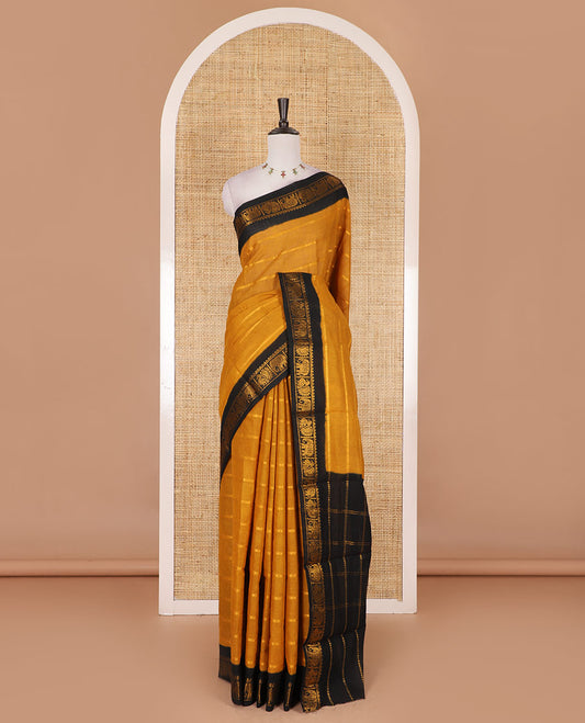Mustard veldhari zari striped Sungudi cotton saree, contrast peacock and elephant motif border, striped pallu, and contrast zari design blouse