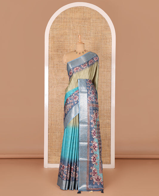 Blue tri-ombre colored zari stripes, and floral printed semi-tussar saree, contrast floral zari border, kalamkari printed pallu, and a contrast blouse of zari and print work