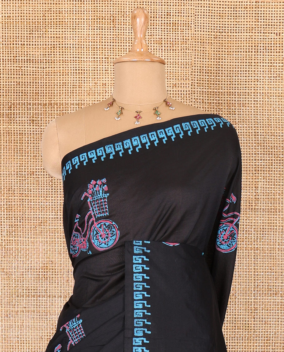 Black cycle with flower basket motifs block printed South cotton saree, Greek key motifs block printed border, a matching blouse, and a contrast floral motifs printed blouse