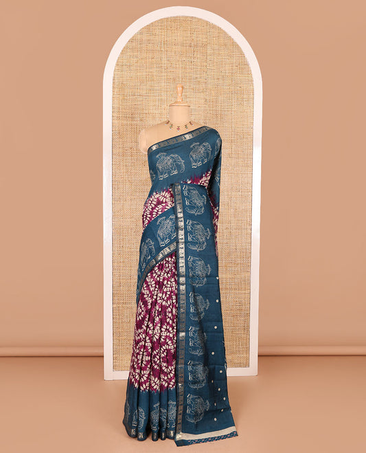 Purple shibori printed muslin cotton saree, contrast zari border of elephant motifs print, big elephant printed pallu, and a contrast printed blouse