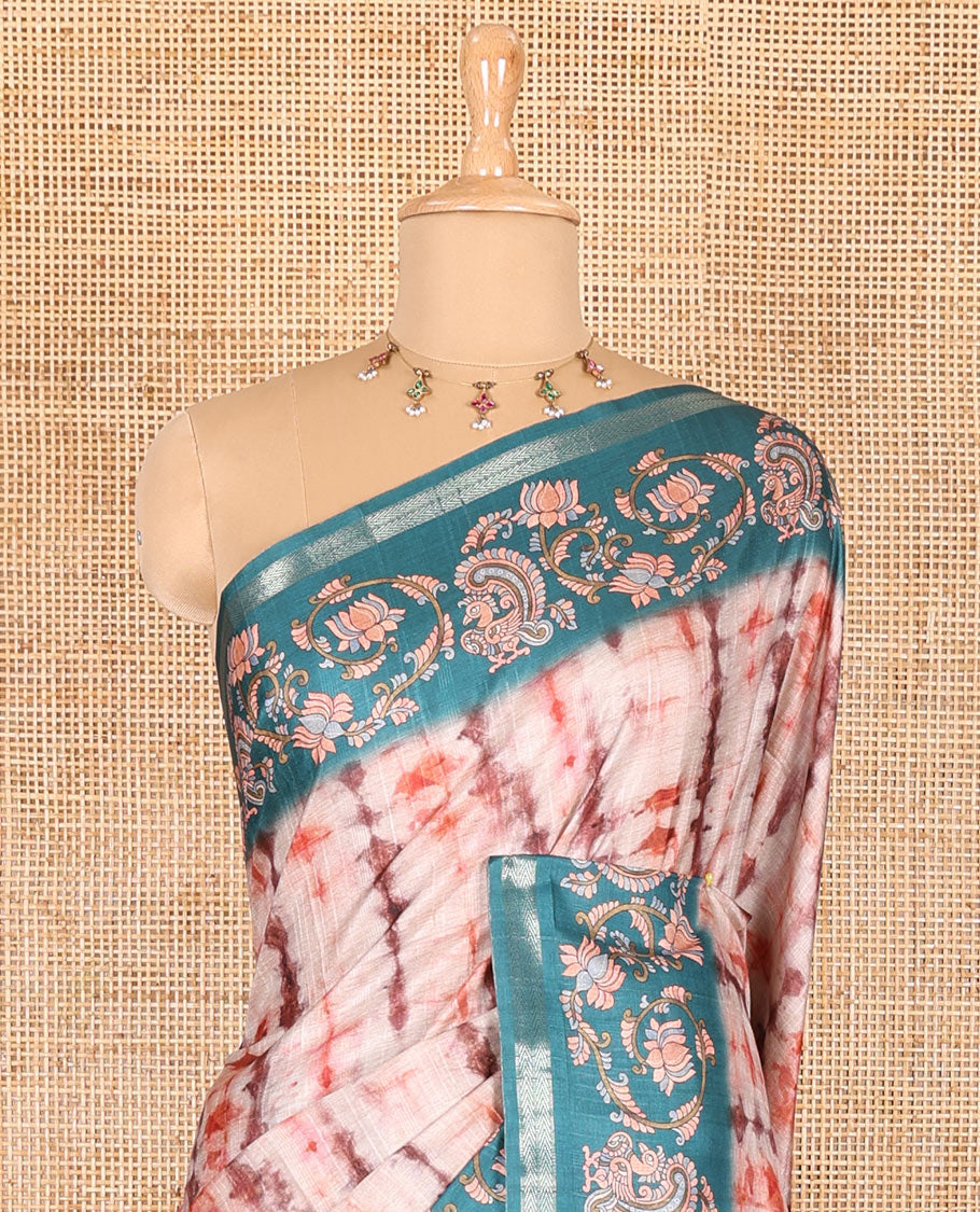 Orange shibori printed katan silk saree, contrast border, and pallu of kalamkari floral vine and peacock print, and a contrast leaf printed blouse