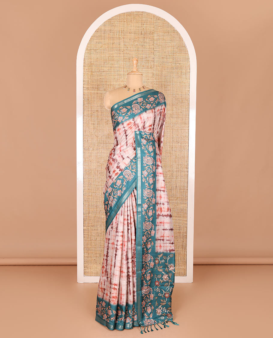 Orange shibori printed katan silk saree, contrast border, and pallu of kalamkari floral vine and peacock print, and a contrast leaf printed blouse
