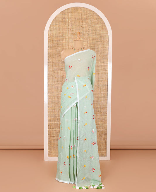 Borderless pista green floral motifs thread embroidered khadi mul cotton saree, floral motifs thread embroidered pallu, and a matching plain blouse