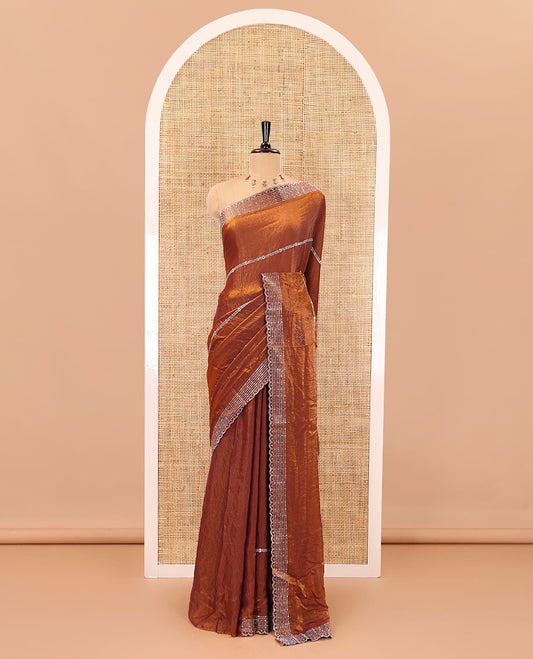 Honey color horizontally swarovski stone striped fendi chiffon saree, swarovski stone work border, and a plain blouse