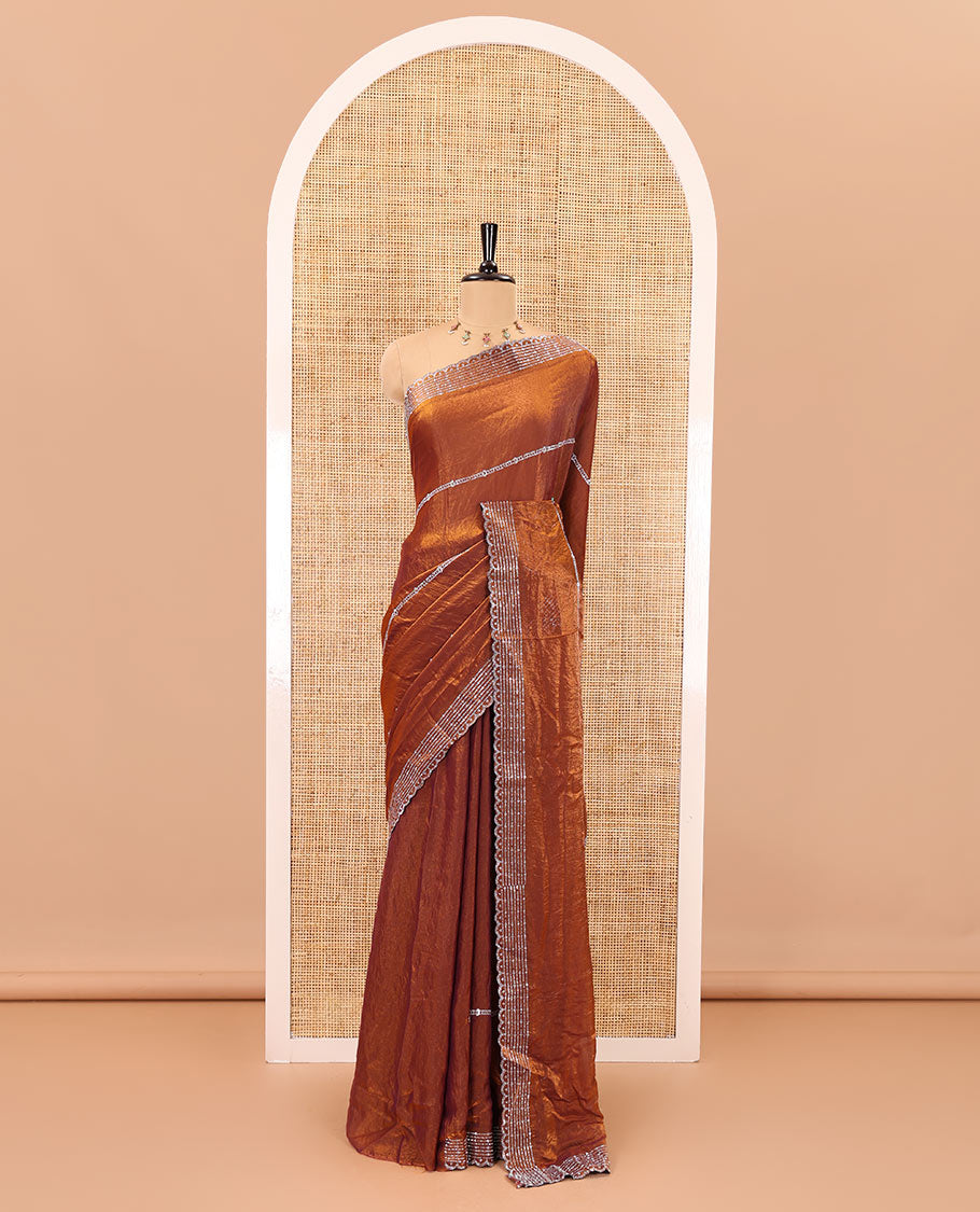 Honey color horizontally swarovski stone striped fendi chiffon saree, swarovski stone work border, and a plain blouse