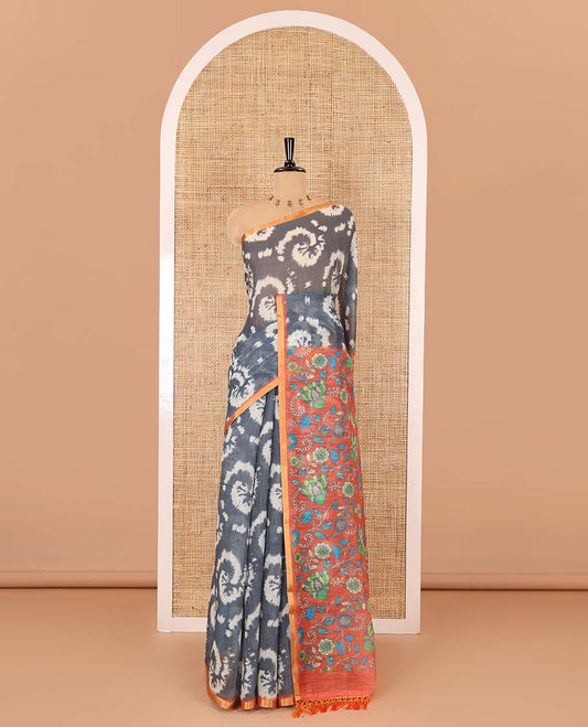 Borderless grey shibori printed linen cotton saree, contrast kaleidoscope colored kalamkari floral vine print, and a contrast printed blouse