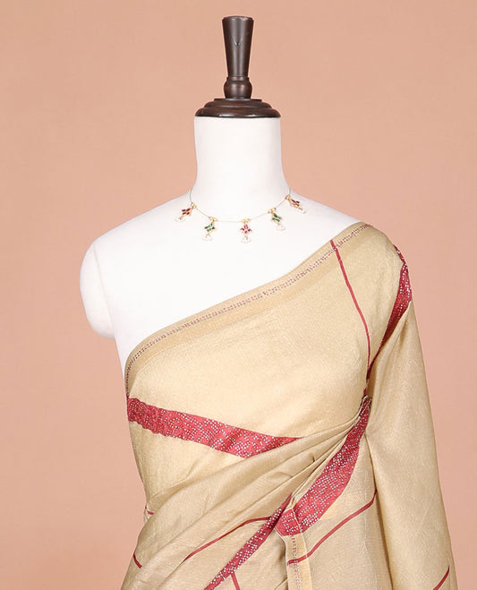 Cream with red fancy print, swarovski stone work cruncy crush saree, swarovski stone work border & self pallu along with swarovski stone work blouse