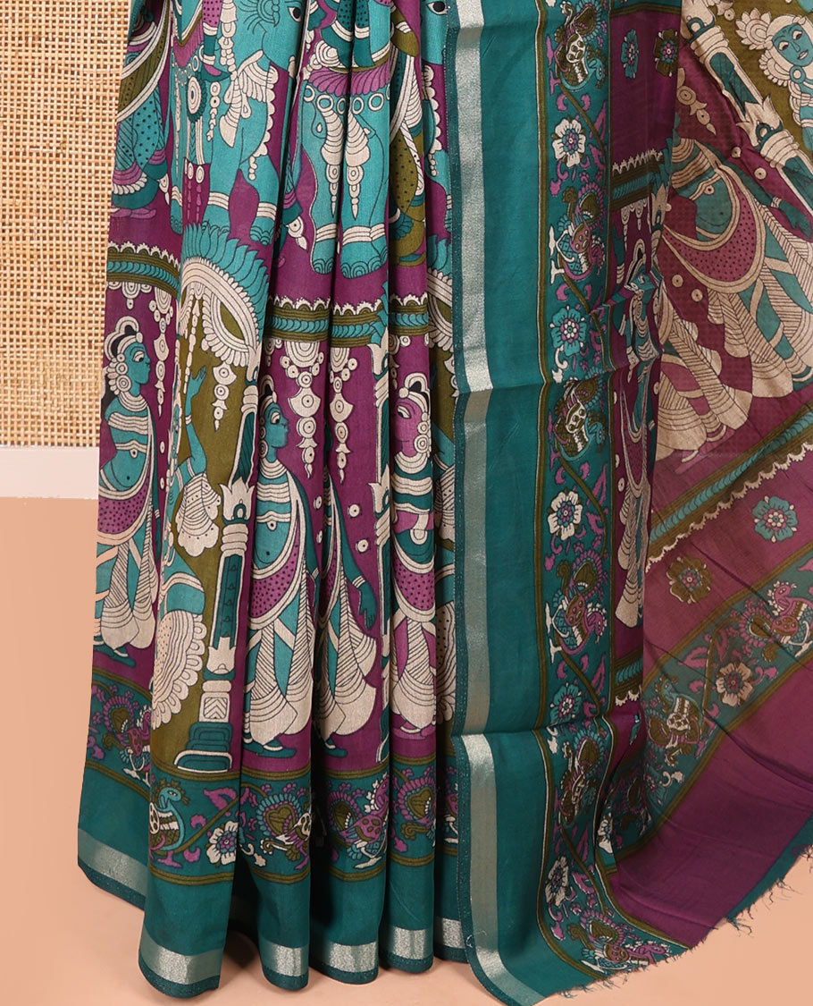 Purple human figurines printed muslin cotton saree, contrast floral-peacock printed border of piping work, kalamkari printed pallu, and a contrast blouse of flower motifs print
