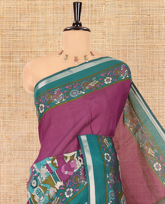 Purple human figurines printed muslin cotton saree, contrast floral-peacock printed border of piping work, kalamkari printed pallu, and a contrast blouse of flower motifs print