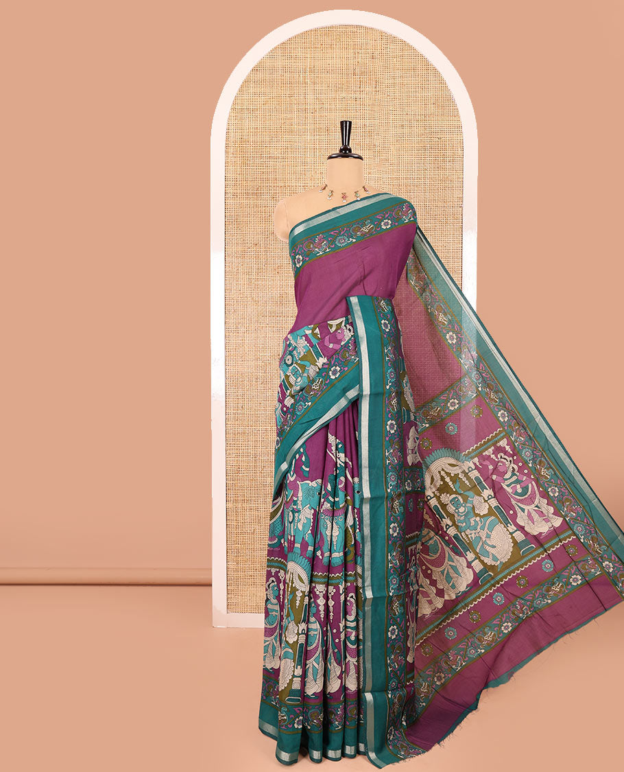 Purple human figurines printed muslin cotton saree, contrast floral-peacock printed border of piping work, kalamkari printed pallu, and a contrast blouse of flower motifs print