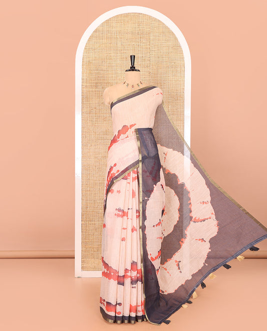 Peach shibori printed linen cotton saree, contrast piping zari border, shibori circle printed pallu, and a contrast shibori printed blouse