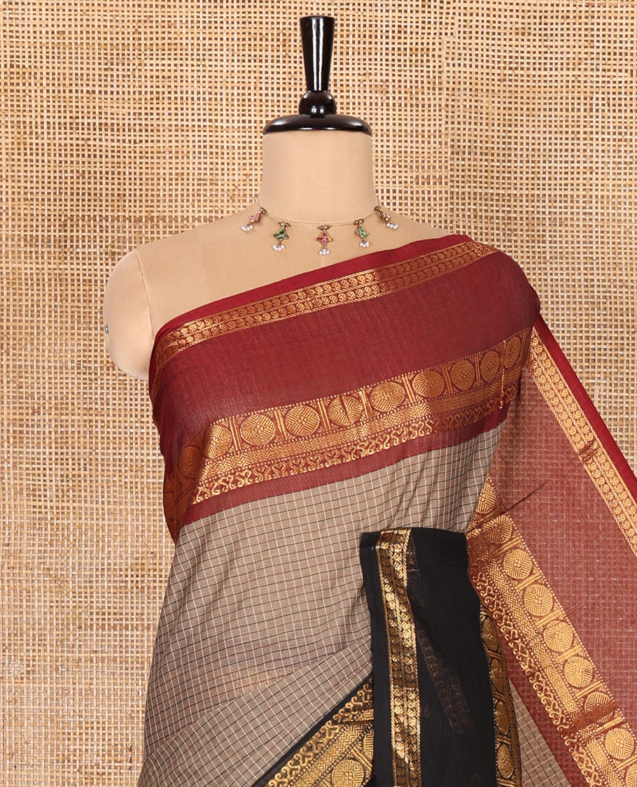 Brown Checked Chettinad Cotton Saree, Accentuated with Contrast Ganga Jamuna Rettai Pettu-Style Rudraksham Motifs Border, Subtly Zari Striped Pallu, and a Matching Blouse