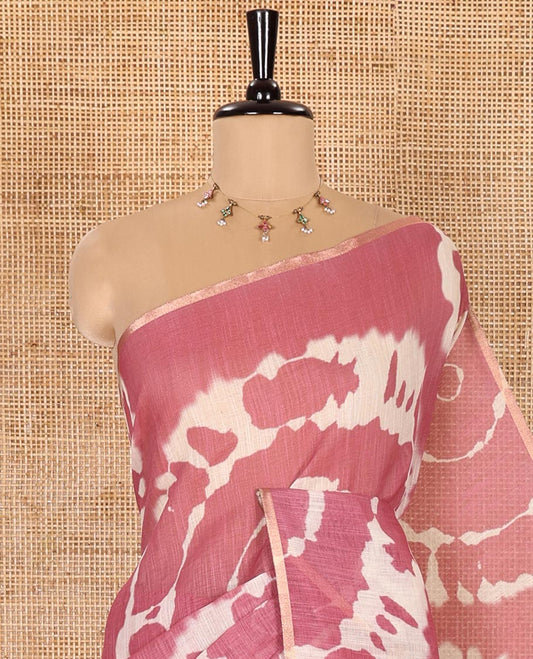 Borderless Onion Pink Linen Cotton Saree Decked Up with Shibori Prints, Complemented by Contrast Pallu Steeped with Floral Vine Print, and Paired with a Contrast Floral Printed Blouse