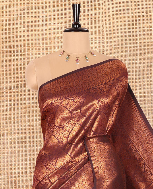 Maroon Kanchi Tissue Saree Embellished with Floral and Thilakam Jacquard Designs, Highlighted with Traditional Zari Design Border, Gleaming Copper Zari Woven Pallu, and Paired with a Matching Blouse