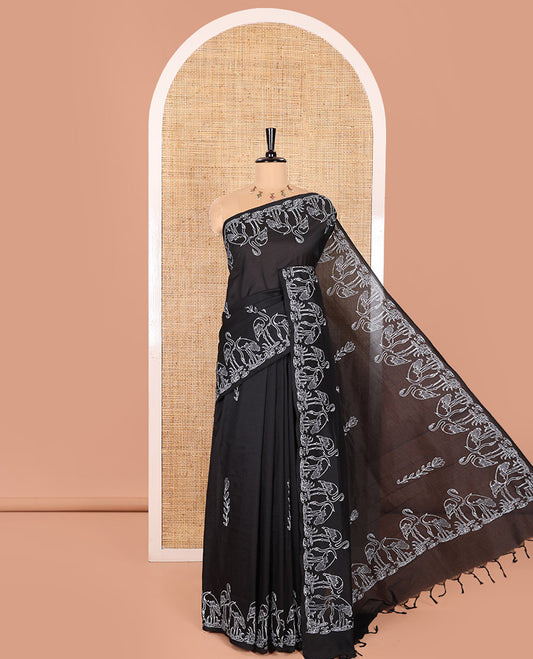 Black South Cotton Saree, Highlighted with Floral Motifs Printed All Over Its Body, Flamigo Motifs Printed Border, and Paired with One Matching Flamigo Printed Blouse, One Contrast Floral Motifs Block Printed Blouse