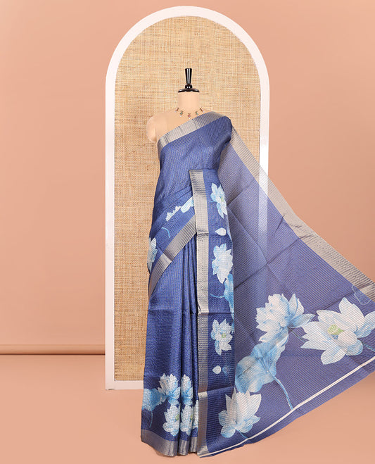Blue Semi Tussar Featuring Micro-Checks and Elegant Lotus Prints All Over Its Body, a Subtle Border, Pallu Mirrors Lotus Motifs, and Comes with a Matching Blouse