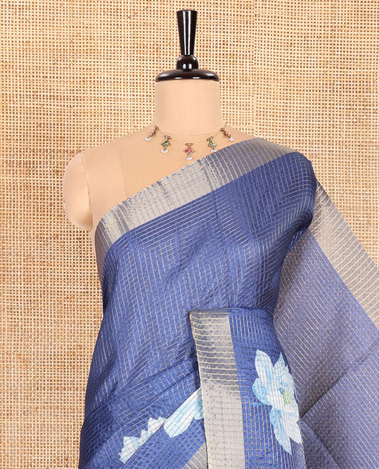 Blue Semi Tussar Featuring Micro-Checks and Elegant Lotus Prints All Over Its Body, a Subtle Border, Pallu Mirrors Lotus Motifs, and Comes with a Matching Blouse