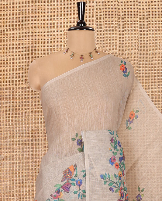 Borderless Chikku Linen Cotton Saree, Artfully Designed with Kaleidoscope-Colored Floral and Bird Motifs Print, Pallu Mirrors the Same Print, and Paired with a Matching Floral Printed Blouse