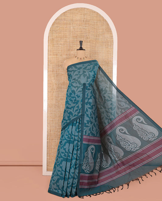 Borderless Rama Blue Coimbatore Cotton Saree, Adorned with Floral Vine Print on Its Body, Self-Pallu Features Paisleys and Geometric Designs, and Paired with a Matching Blouse