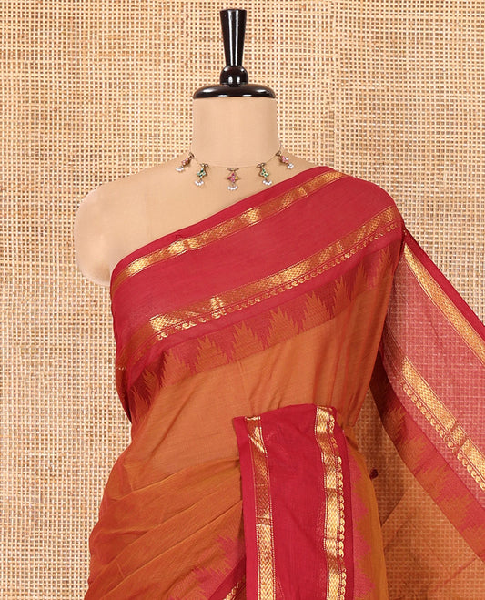 Honey Color Chettinad Cotton Saree, Subtly Sparkled with Thread Buttas All Over Its Body, Complemented by a Contrast Border Rettai Pettu Border of Paisley and Chevron Stripes, Subtly Designed Pallu, and Paired with a Matching Blouse
