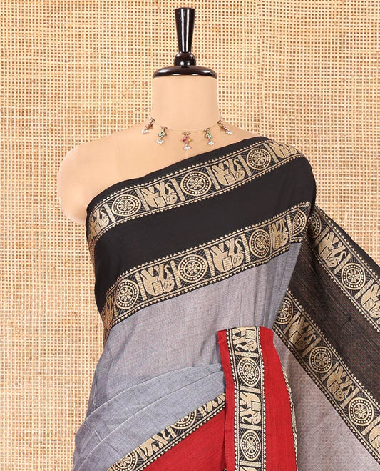 Grey Plain Mercerised Cotton Saree, Complemented by a Contrast Ganga-Jamuna Rettai Pettu Thread Border of Temple, Elephant, and Chakram Designs, Subtly Striped Pallu, and Paired with a Matching Blouse