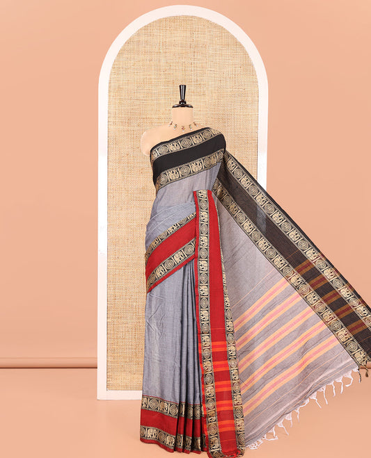 Grey Plain Mercerised Cotton Saree, Complemented by a Contrast Ganga-Jamuna Rettai Pettu Thread Border of Temple, Elephant, and Chakram Designs, Subtly Striped Pallu, and Paired with a Matching Blouse
