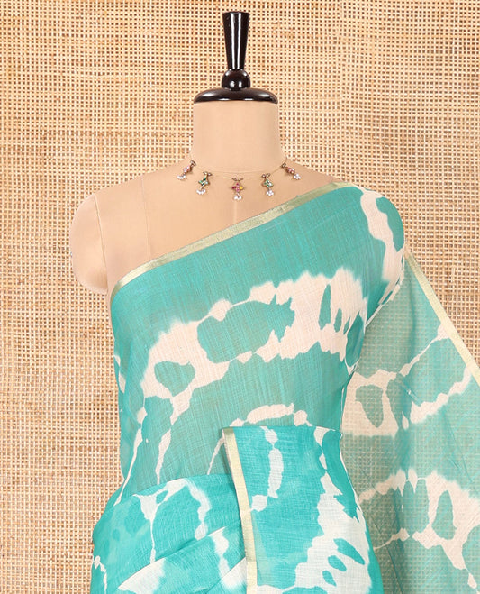 Borderless Rama Linen Cotton Saree, Embellished with Shibori Printed on Its Body, Complemented by Contrast Floral Printed Pallu, and Paired with a Contrast Floral Printed Blouse
