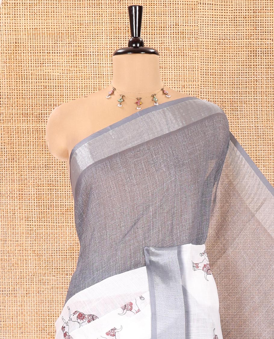Cream and Grey Linen Cotton Saree, Subtly Sparkled with Half-and-Half Style and Elephant Motifs Printed On Its Body, Highlighted by Zari Border, Pallu of Same Print, and Paired with a Printed Blouse