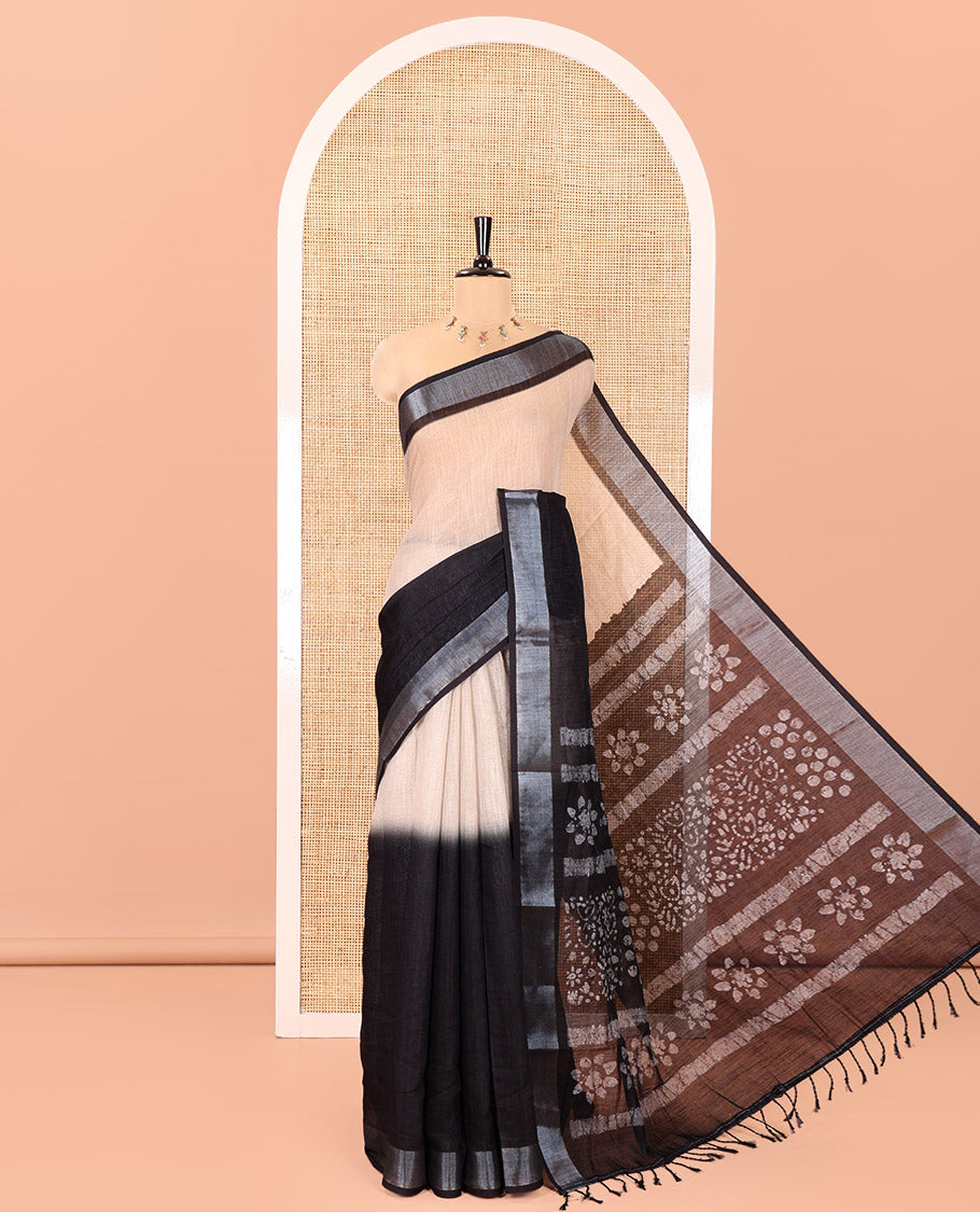 Chikku and Black Linen Cotton Saree, Subtly Designed with Half-And-Half-Style Dual-Color Dye on Its Body, Complemented by a Contrast Bavanji Border, Pallu of Batik Print, and Paired with a Contrast Blouse