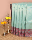 Green copper zari weaving litchi silk saree with contrast meena butta border & meena style design pallu along with contrast blouse
