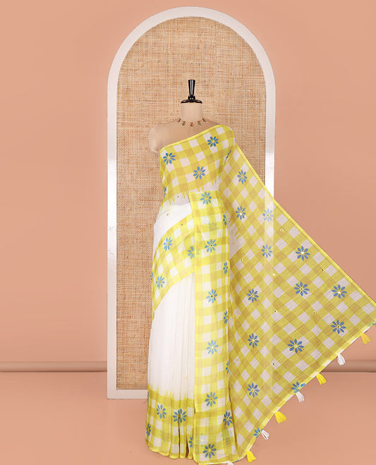 White and Green Linen Cotton Saree, Adorned with Mirror Work On Its Body, Complemented by Contrast Temple Checked Border of Floral Print and Mirror Work, Pallu Mirrors the Same Design and Paired with a Contrast Blouse
