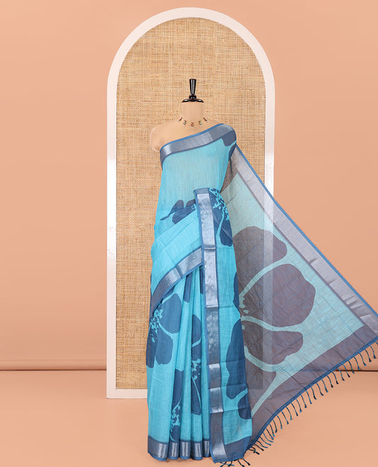 Blue Linen Cotton Saree, Prettified with Floral Print All Over Its Body, Complemented by a Contrast Zari Bavanji Border, Floral Printed Pallu, and Paired with a Matching Blouse