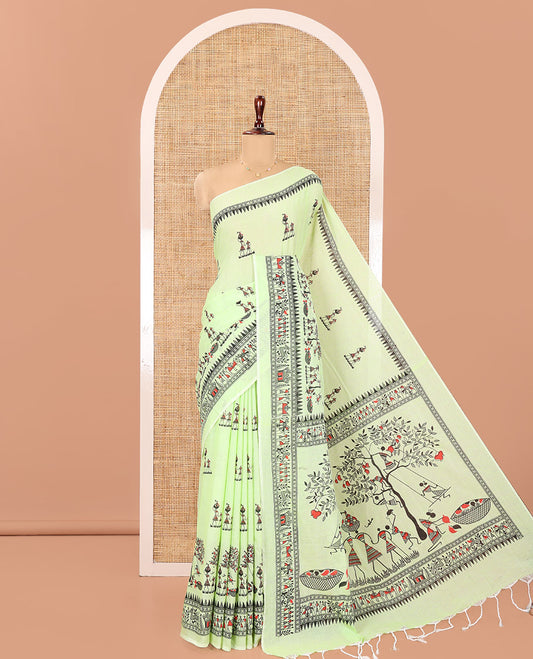 Pista Green Khadi Mul Cotton Saree, Artfully Printed with Warli Motifs All Over Its Body, Highlighted by a Self-Border of Warli Print, Pallu of Warli Print, and Paired with a Matching Blouse