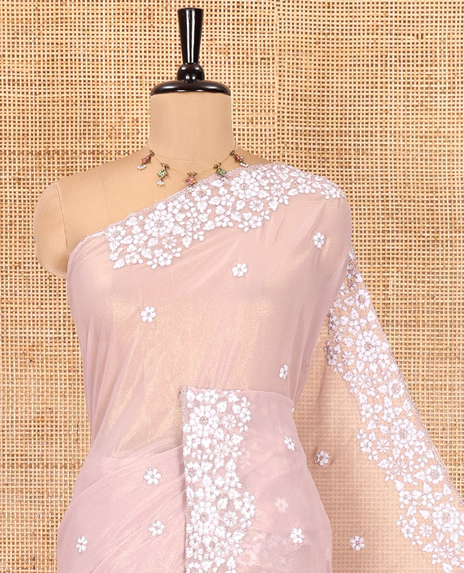 Dusky Pink Shimmer Chiffon Saree, Artfully Detailed with Floral Embroidery on Its Body, Scallop Floral Embroidery Border, a Self-Pallu, and Paired with a Matching Embroidered Blouse