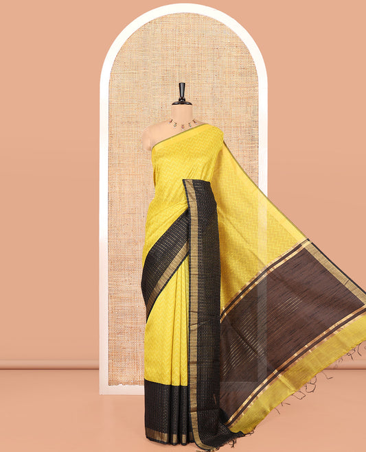 Yellow and Black Semi-Raw Silk Saree, Delicately Woven with Zig-Zag Stripes All Over Its Body, Complemented by Contrast Border of Butta Enclosed Checks, Striped Pallu, and Paired with a Contrast Blouse