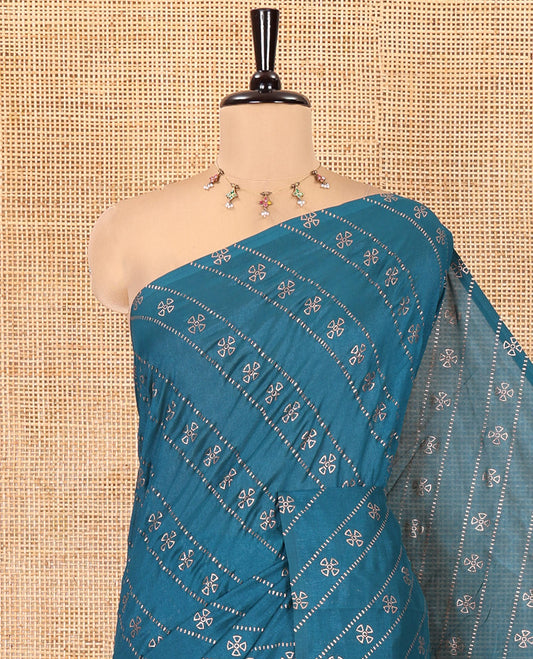 Borderless Peacock Blue Vichitra Silk Saree, Gleamed Up with Floral Buttas and Leheriya-Style Foil Print on Its Body, a Self-Pallu, and Has No Blouse