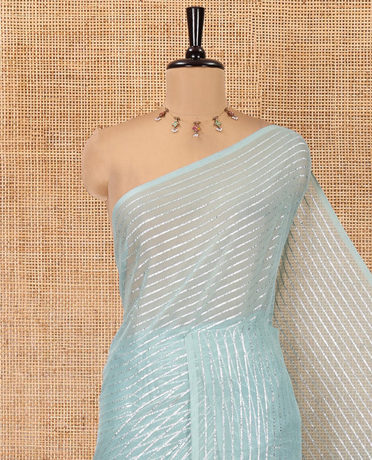 Borderless Sea Green Chiffon Saree, Gleamed Up with Horizontal Stripes on Its Body, a Self-Pallu, and Has No Blouse