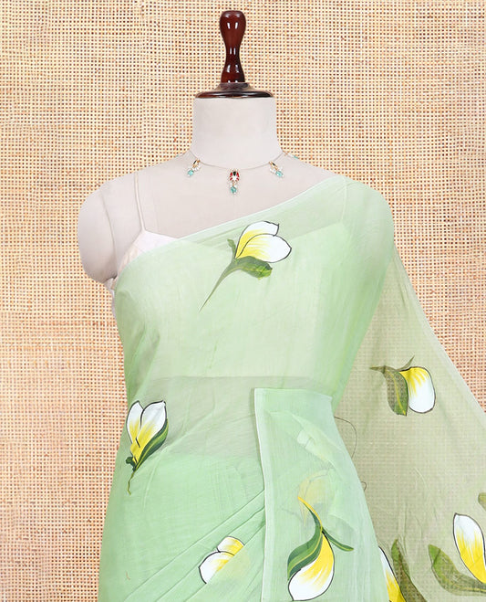 Borderless Pista Green Khadi Mul Cotton Saree Features Floral Hand-Brush Painting, and a Matching Blouse