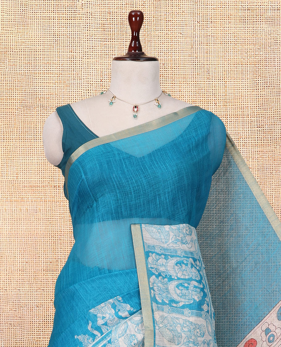 Blue Linen Cotton Saree Features Kalamkari-Style Human Motifs Print, a Piping Border, Contrast Printed Pallu, and Contrast Blouse