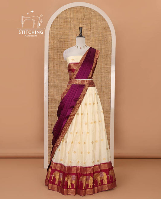 Cream semi-banaras half-saree, buttas & contrast traditional zari elephant border skirt, zari blouse & contrast-wine zari border georgette dhavani