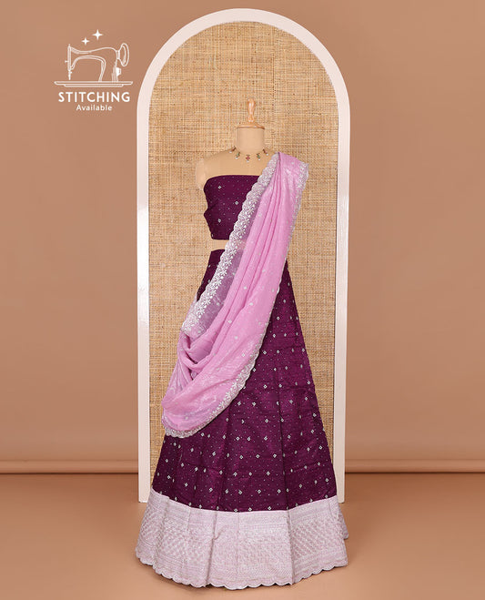 Purple half-saree, floral motifs embroidered semi-raw silk top, matching embroidered blouse, and contrast scallop embroidered georgette dhavani