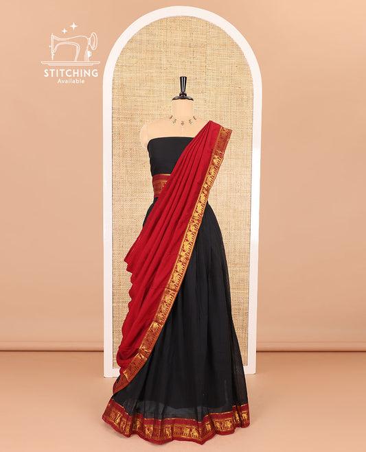Black half-saree, plain with contrast traditional zari elephant border skirt, matching blouse, and a contrast zari border dupatta