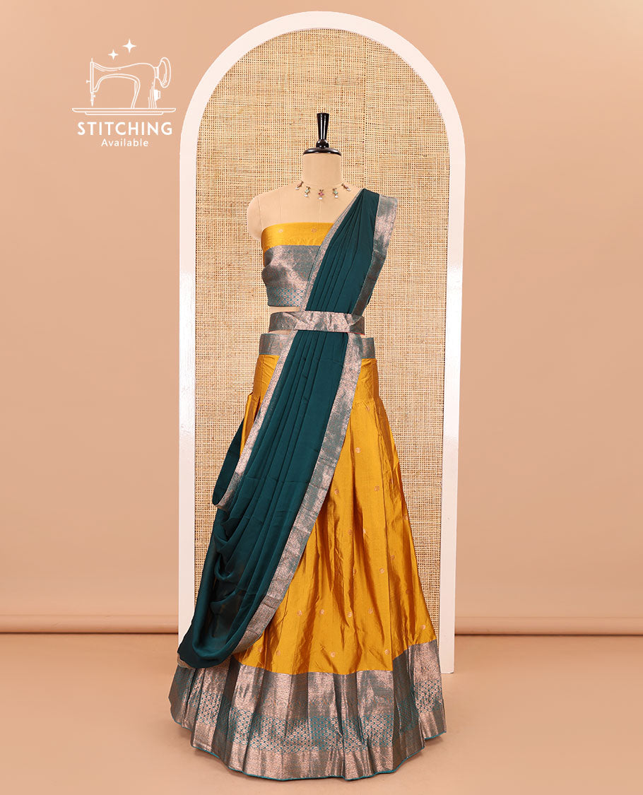 Mustard-rama taffeta half-saree, zari buttas with contrast traditional zari bordered skirt, a matching blouse, and contrast zari border dhavani with belt